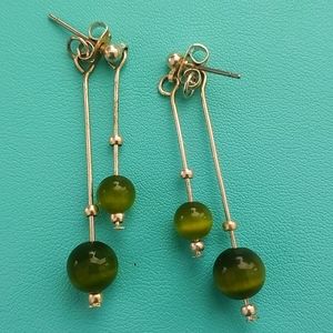 Green beaded dangle earrings